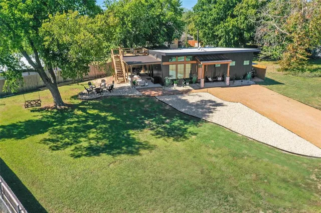 an aerial view of a house with mountain view