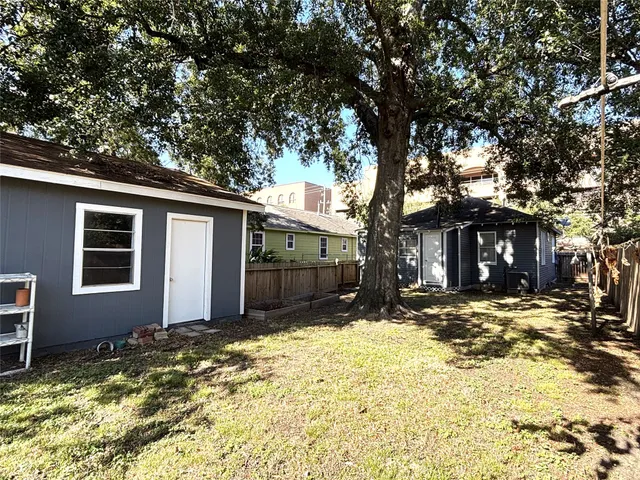 a front view of house with yard covered in snow