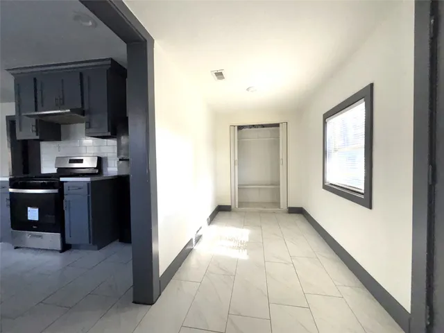 a view of a kitchen with electric appliances