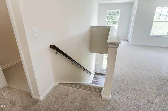 a view of entryway with furniture and stairs