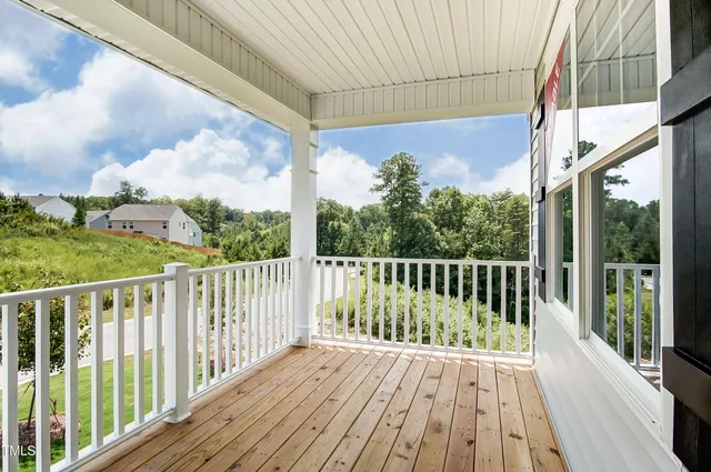 a bathroom with a tub sink double vanity and mirror