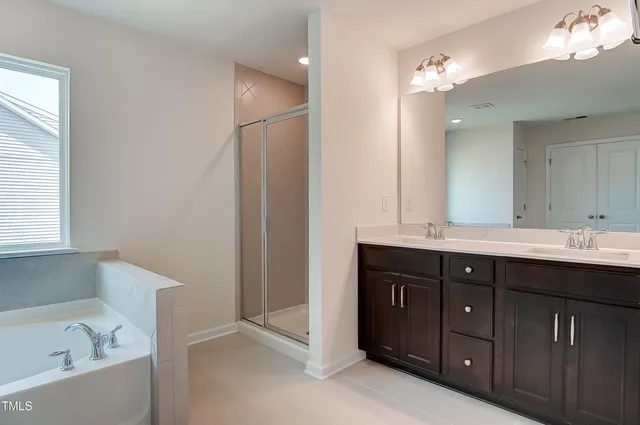 a bathroom with a bathtub and a sink