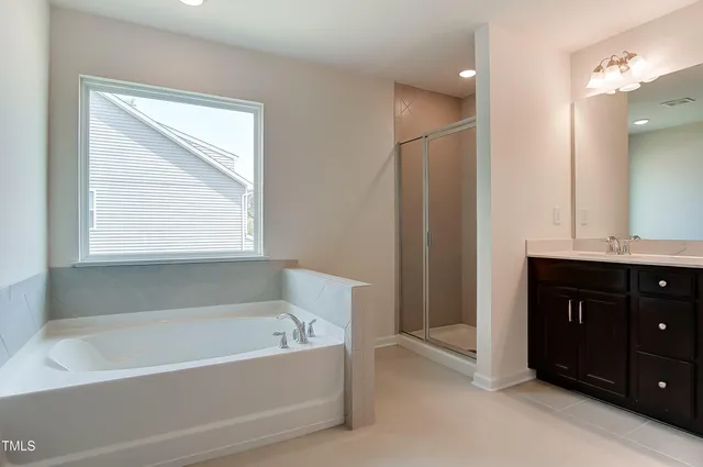 a bathroom with a shower and a sink