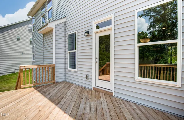 a view of a balcony with wooden floor