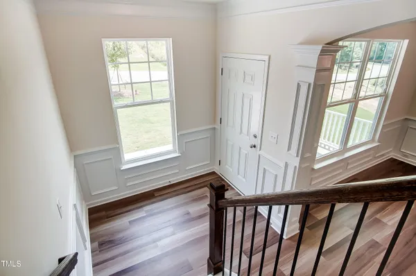 a view of an entryway with wooden floor