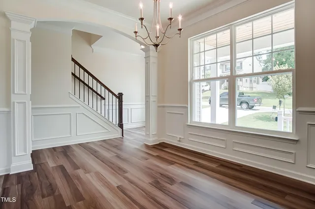 a view of an entryway with wooden floor