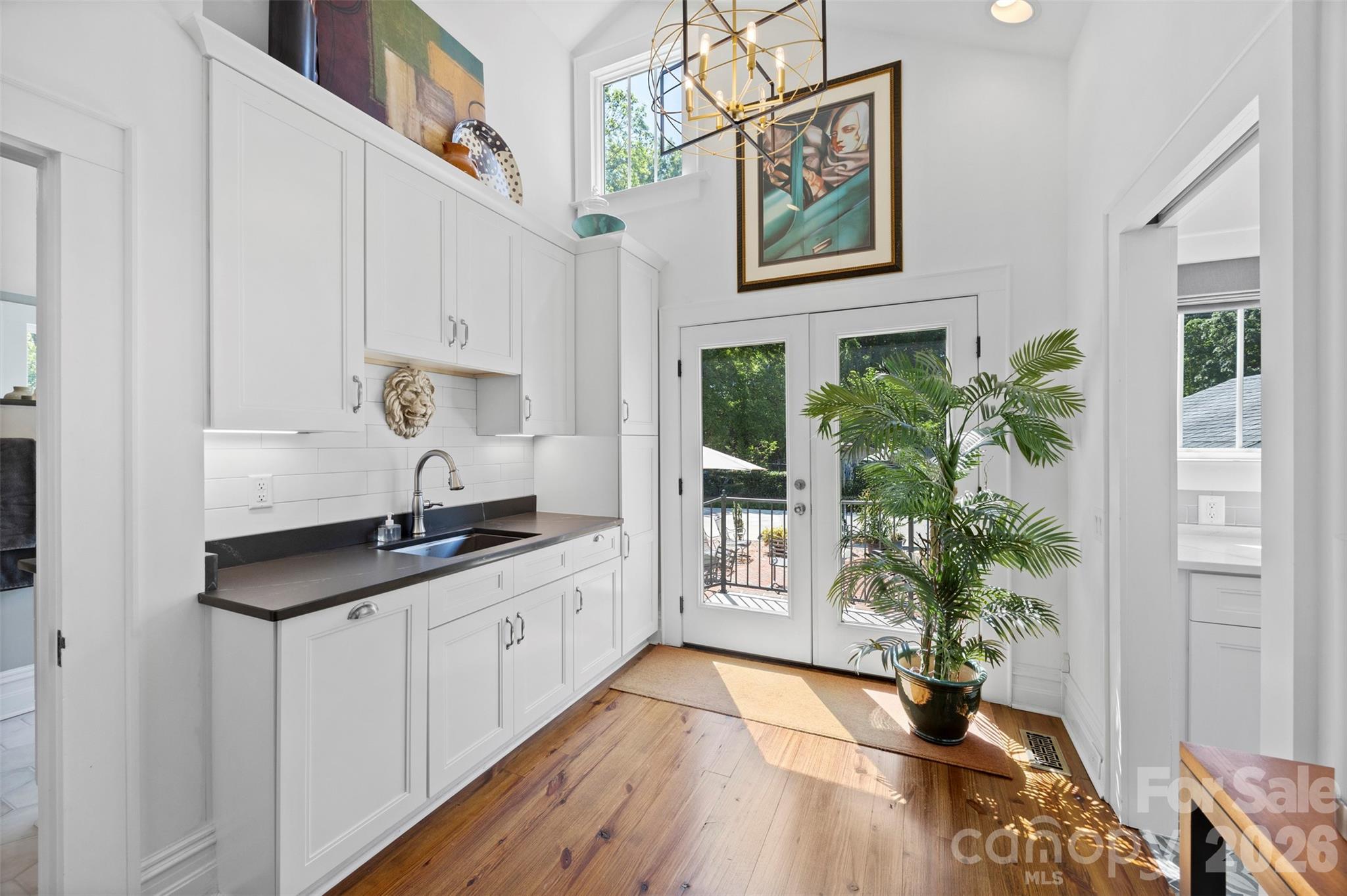 207 West Academy Street Cherryville, NC 28021 - Photo 21 of 45 a hallway with view of wooden floor and a potted plant