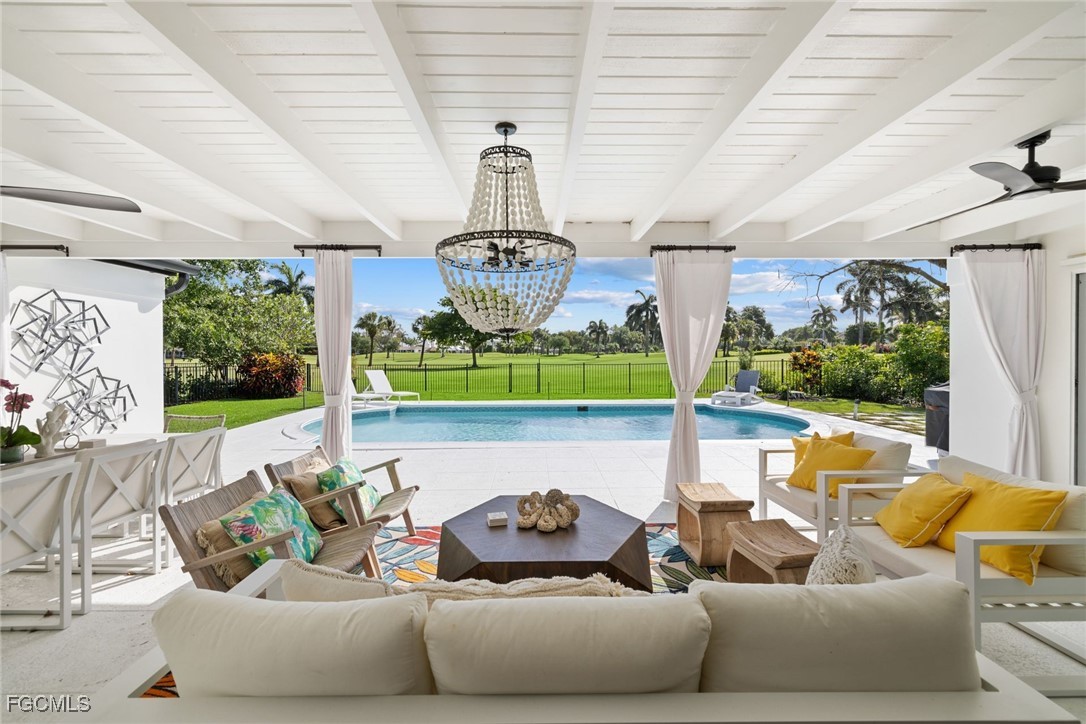 2728 Crayton Road Naples, FL 34103 - Photo 1 of 35 a outdoor living space with furniture