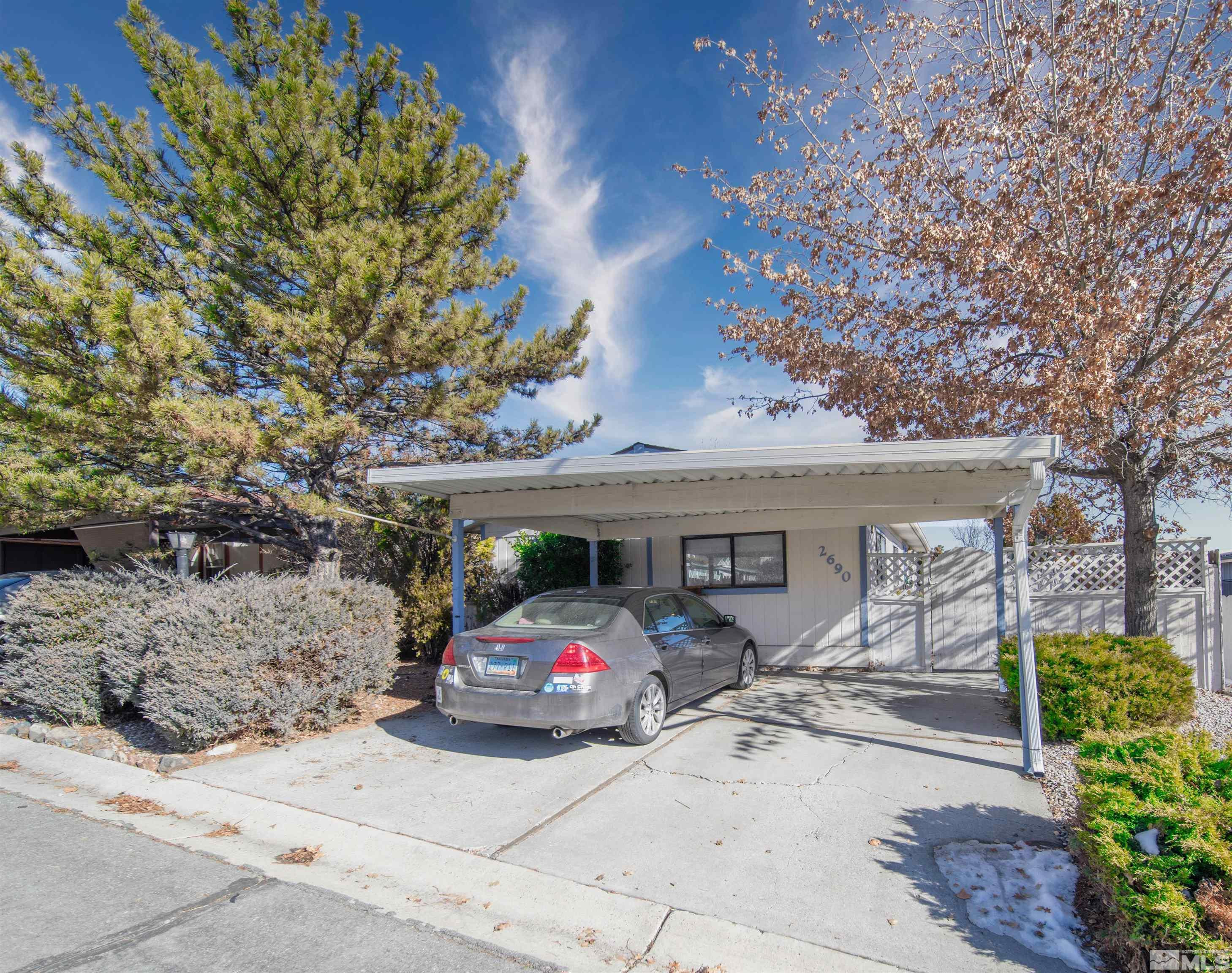 2690 Daffodil Way Reno, NV 89512 - Photo 1 of 20 a front view of a house with garden