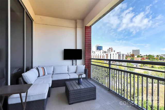 a balcony with furniture and a balcony