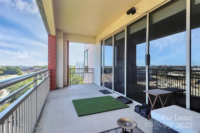 a view of balcony with furniture