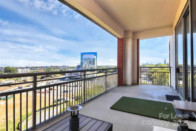 a view of a balcony with city view