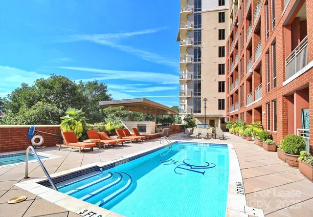 a view of a swimming pool with lounge chairs