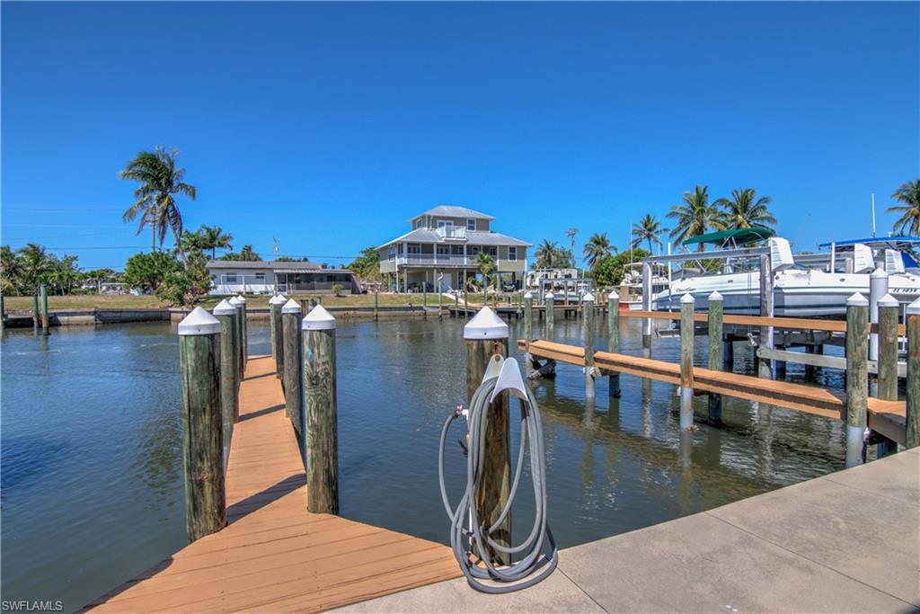 3215 Stringfellow Road, Unit 2A St. James City, FL 33956 - Photo 1 of 31 a view of a lake with a house