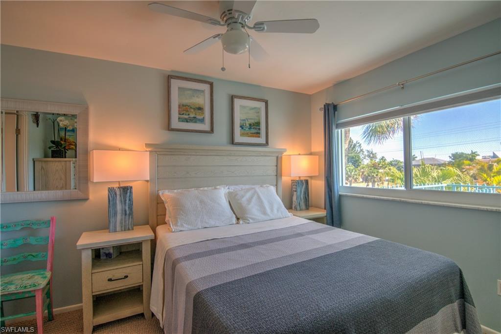 3215 Stringfellow Road, Unit 2A St. James City, FL 33956 - Photo 11 of 31 a bedroom with a bed and a window
