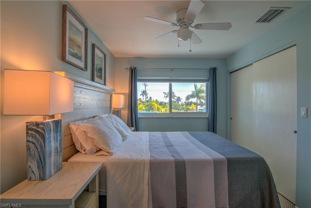 3215 Stringfellow Road, Unit 2A St. James City, FL 33956 - Photo 13 of 31 a bed room with a bed and a television