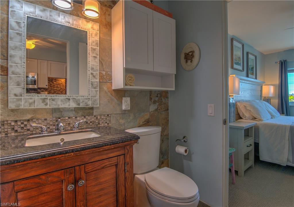 3215 Stringfellow Road, Unit 2A St. James City, FL 33956 - Photo 15 of 31 a bathroom with a sink vanity granite and toilet