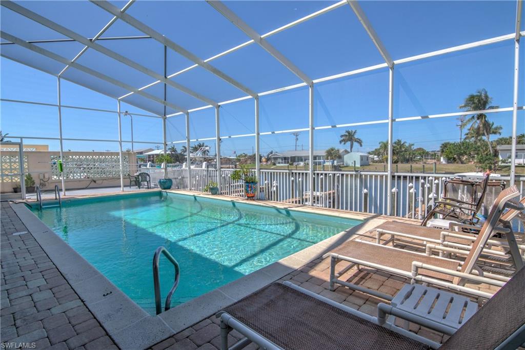 3215 Stringfellow Road, Unit 2A St. James City, FL 33956 - Photo 16 of 31 a view of a backyard with sitting area