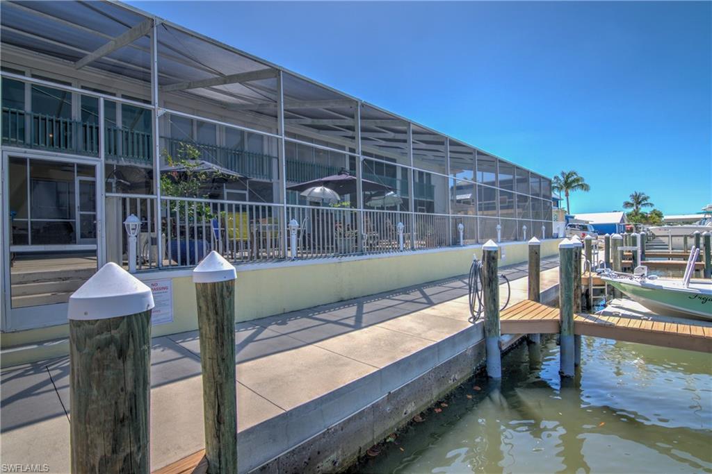 3215 Stringfellow Road, Unit 2A St. James City, FL 33956 - Photo 18 of 31 a view of a balcony with chairs