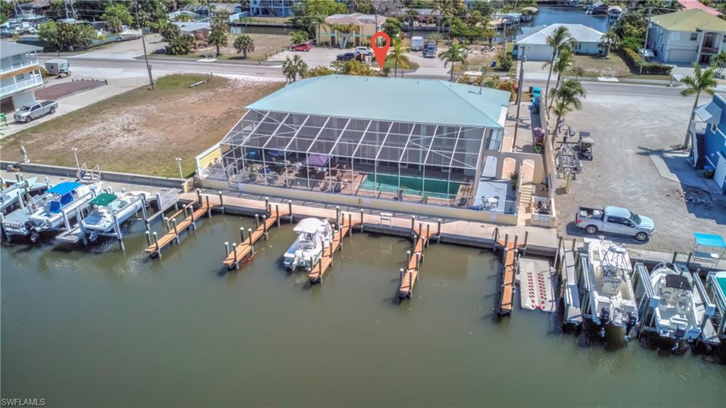 3215 Stringfellow Road, Unit 2A St. James City, FL 33956 - Photo 21 of 31 an aerial view of a house with swimming pool