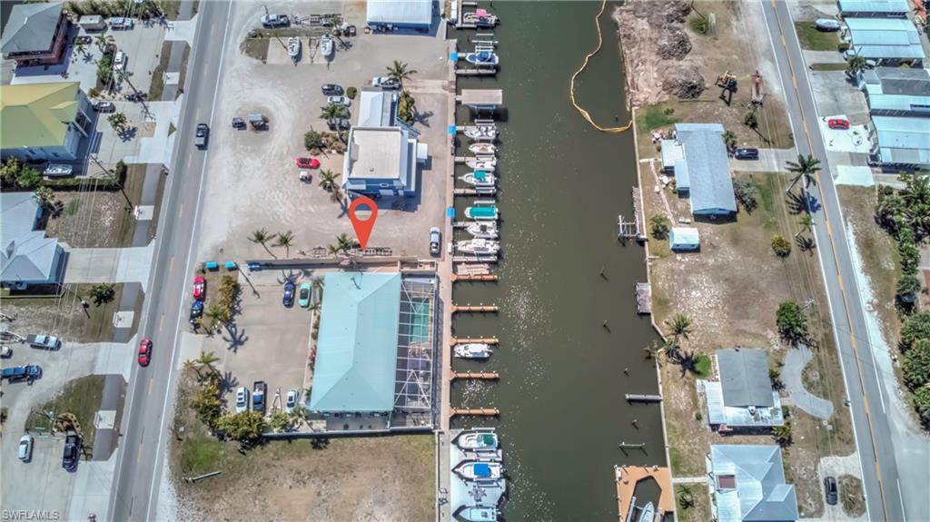 3215 Stringfellow Road, Unit 2A St. James City, FL 33956 - Photo 27 of 31 an aerial view of residential houses with outdoor space and parking