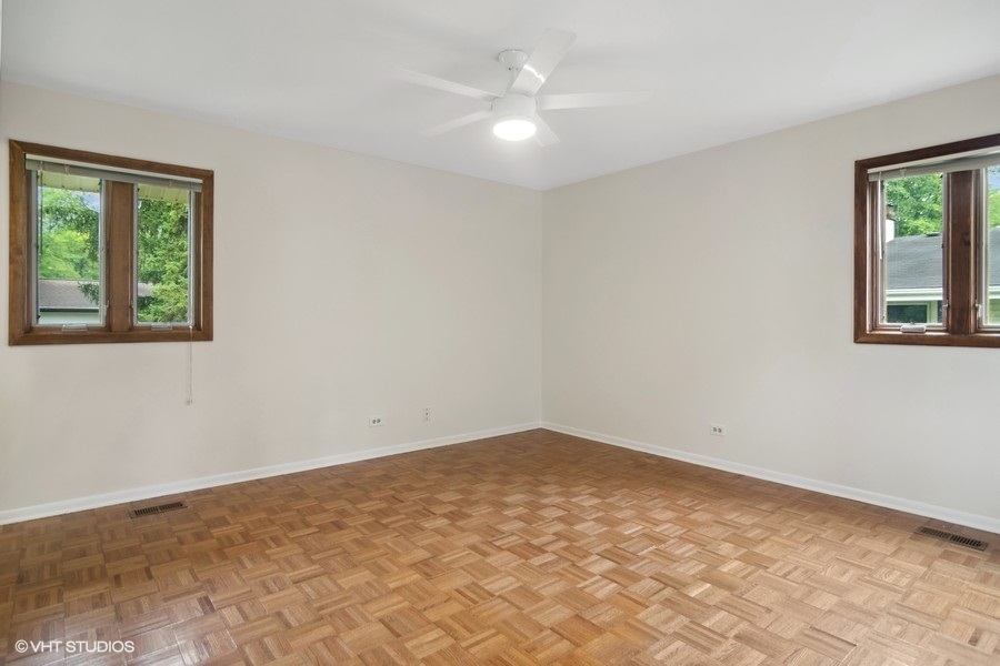 517 North Rohlwing Road Palatine, IL 60074 - Photo 10 of 17 an empty room with windows and fan