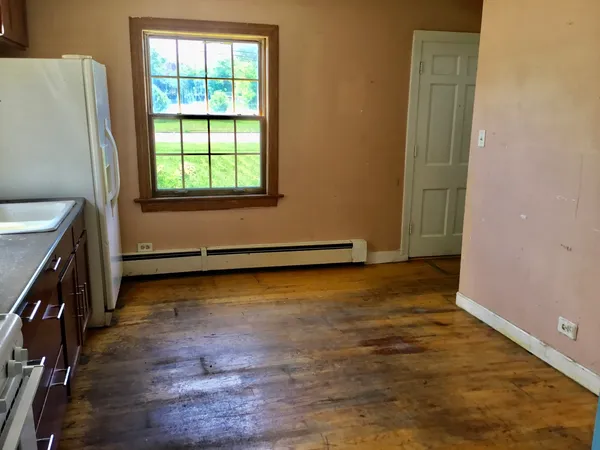 a view of an empty room and window