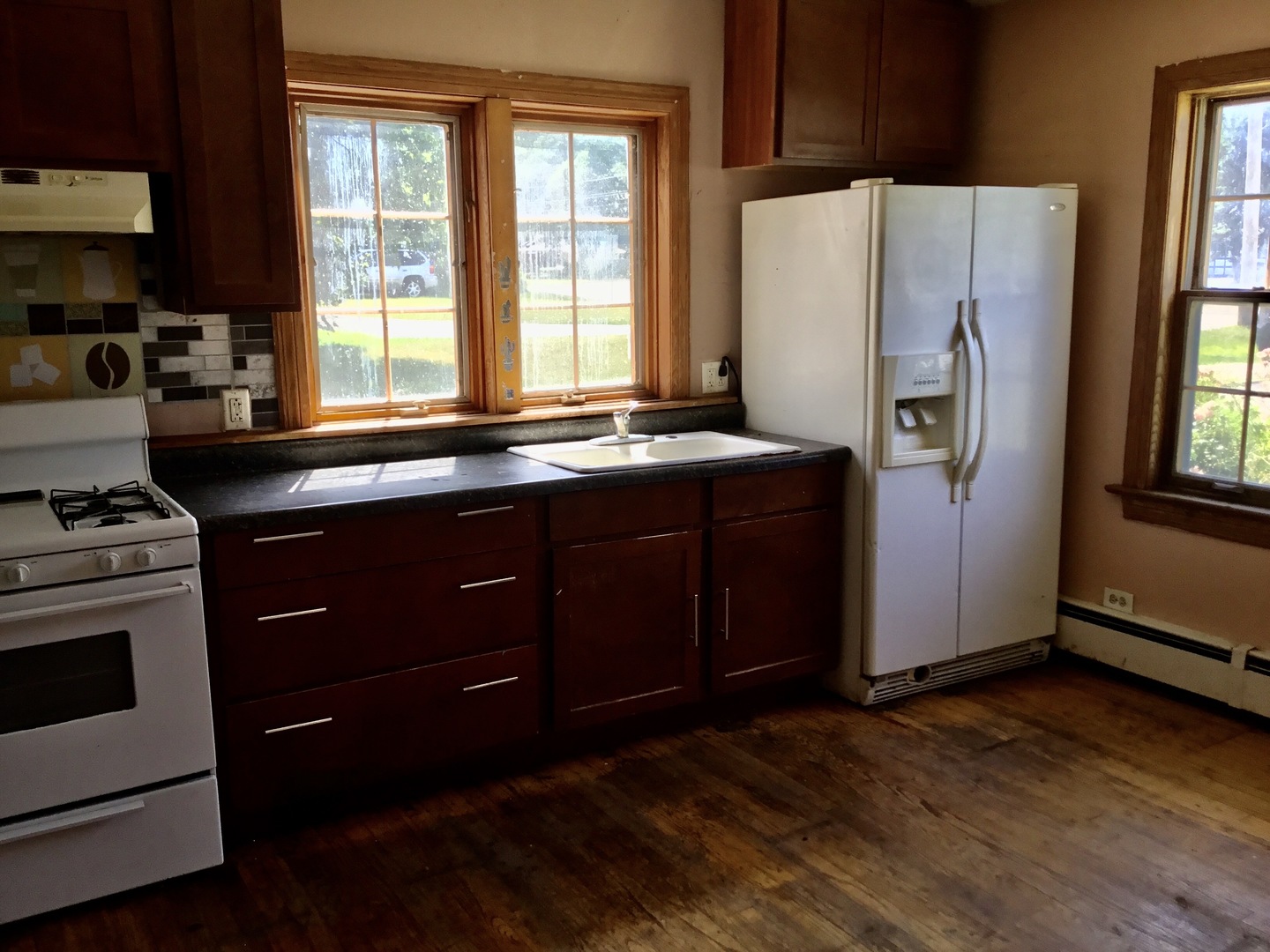 206 East Camp McDonald Road Prospect Heights, IL 60070 - Photo 13 of 57 a kitchen with stainless steel appliances a stove a refrigerator and a window