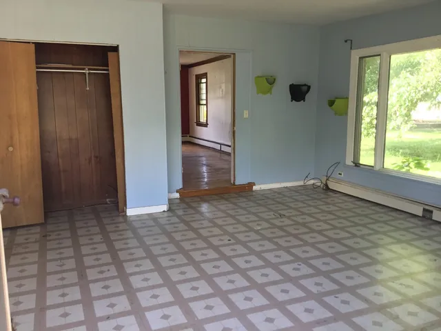 a view of an empty room and window