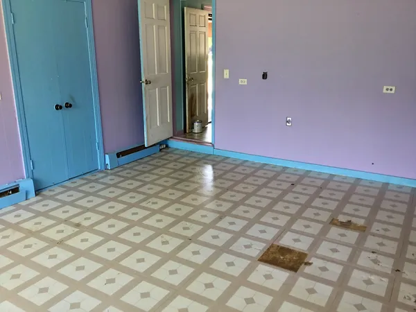 a view of an empty room and window