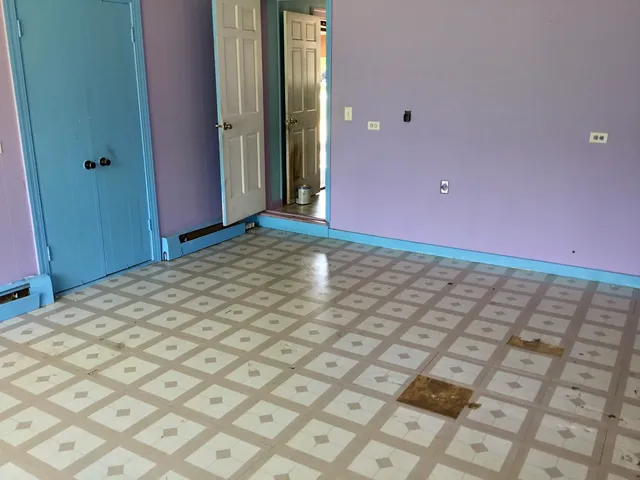 a view of an empty room and window