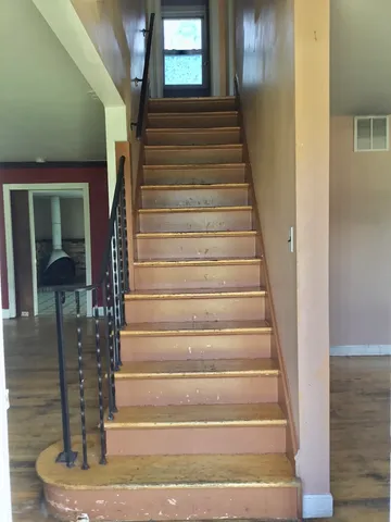 a view of a room with window and cabinet