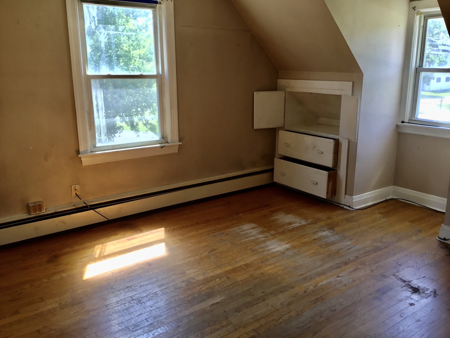 206 East Camp McDonald Road Prospect Heights, IL 60070 - Photo 26 of 57 an empty room with wooden floor and windows