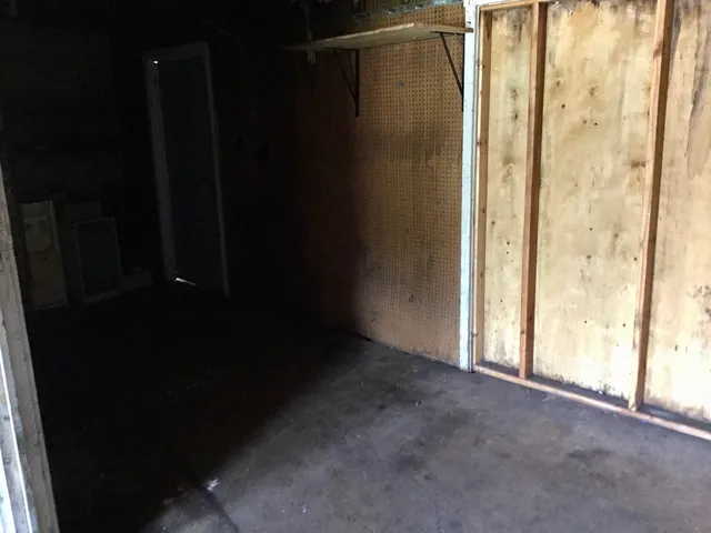 a view of a field of grass and trees