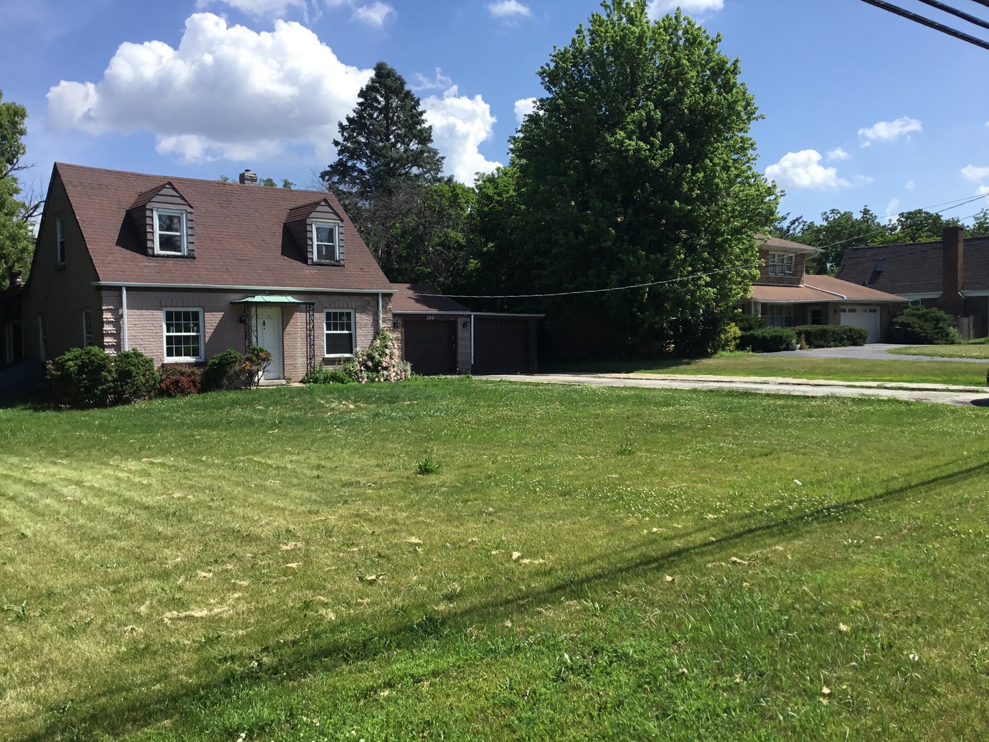 206 East Camp McDonald Road Prospect Heights, IL 60070 - Photo 57 of 57 a white house with a big yard and large trees