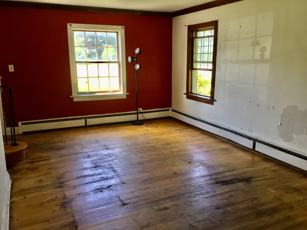 a view of empty room with floor to ceiling window