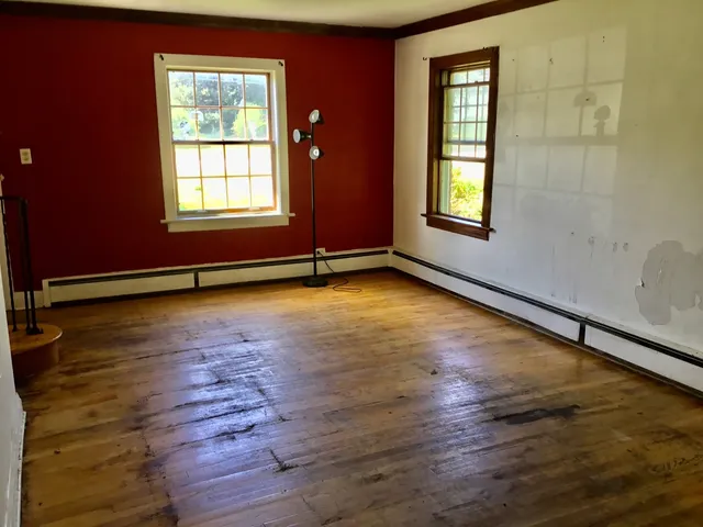 a view of empty room with floor to ceiling window