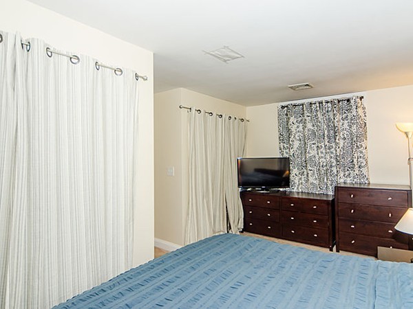 36 Cummings Road, Unit 2 Boston, MA 02135 - Photo 12 of 15 a bedroom with a dresser and a flat screen tv