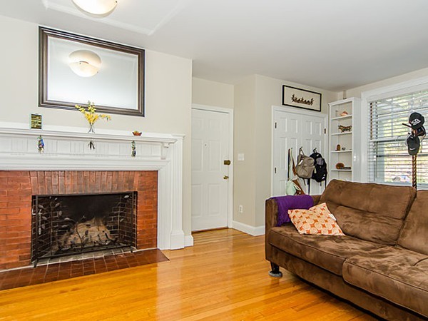 36 Cummings Road, Unit 2 Boston, MA 02135 - Photo 3 of 15 a living room with furniture and a fireplace