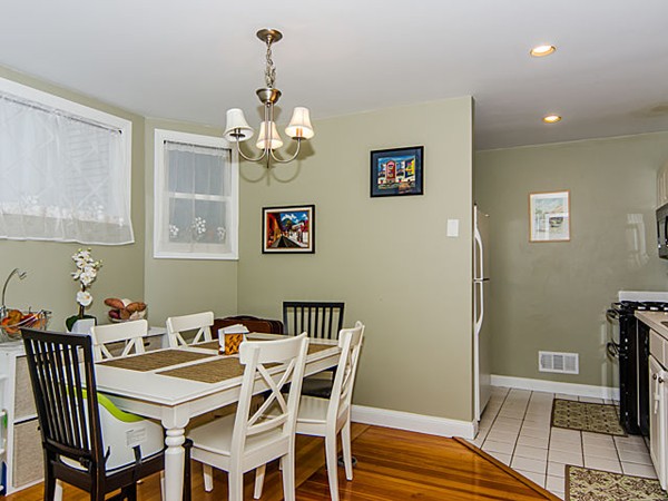 36 Cummings Road, Unit 2 Boston, MA 02135 - Photo 7 of 15 a view of a dining room with furniture wooden floor and a chandelier