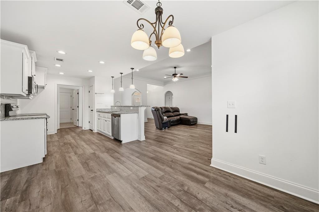 108 Watts Drive Perry, GA 31069 - Photo 19 of 34 a view of a kitchen with kitchen island stainless steel appliances refrigerator stove microwave and cabinets