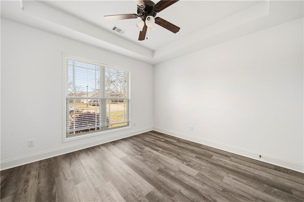 108 Watts Drive Perry, GA 31069 - Photo 23 of 34 a view of an empty room with wooden floor and a window