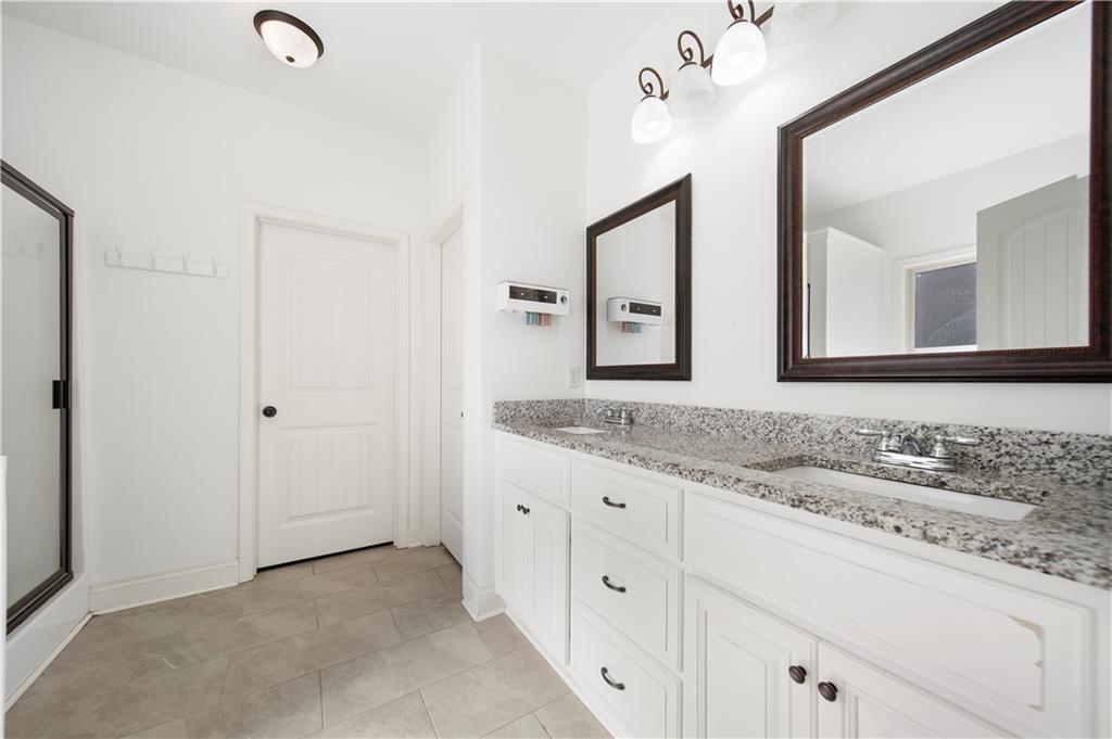 108 Watts Drive Perry, GA 31069 - Photo 29 of 34 a bathroom with a granite countertop sink mirror and double