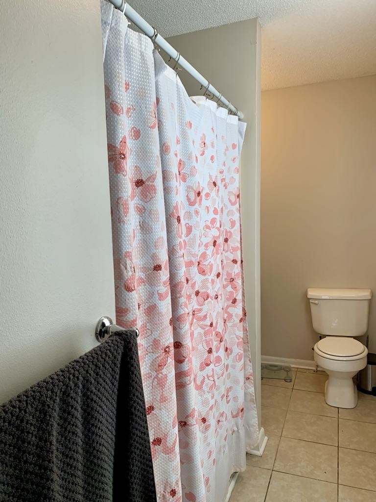 102 McDougal Road Fayetteville, TN 37334 - Photo 19 of 27 a bathroom with a toilet and a shower curtain