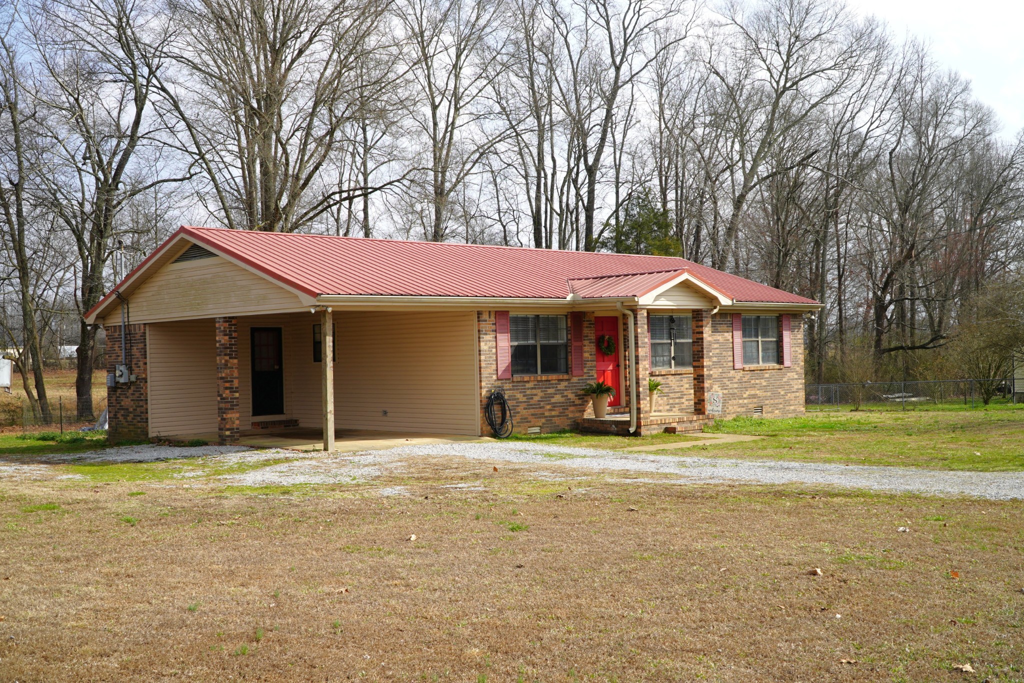 102 McDougal Road Fayetteville, TN 37334 - Photo 3 of 27 a front view of a house with a yard