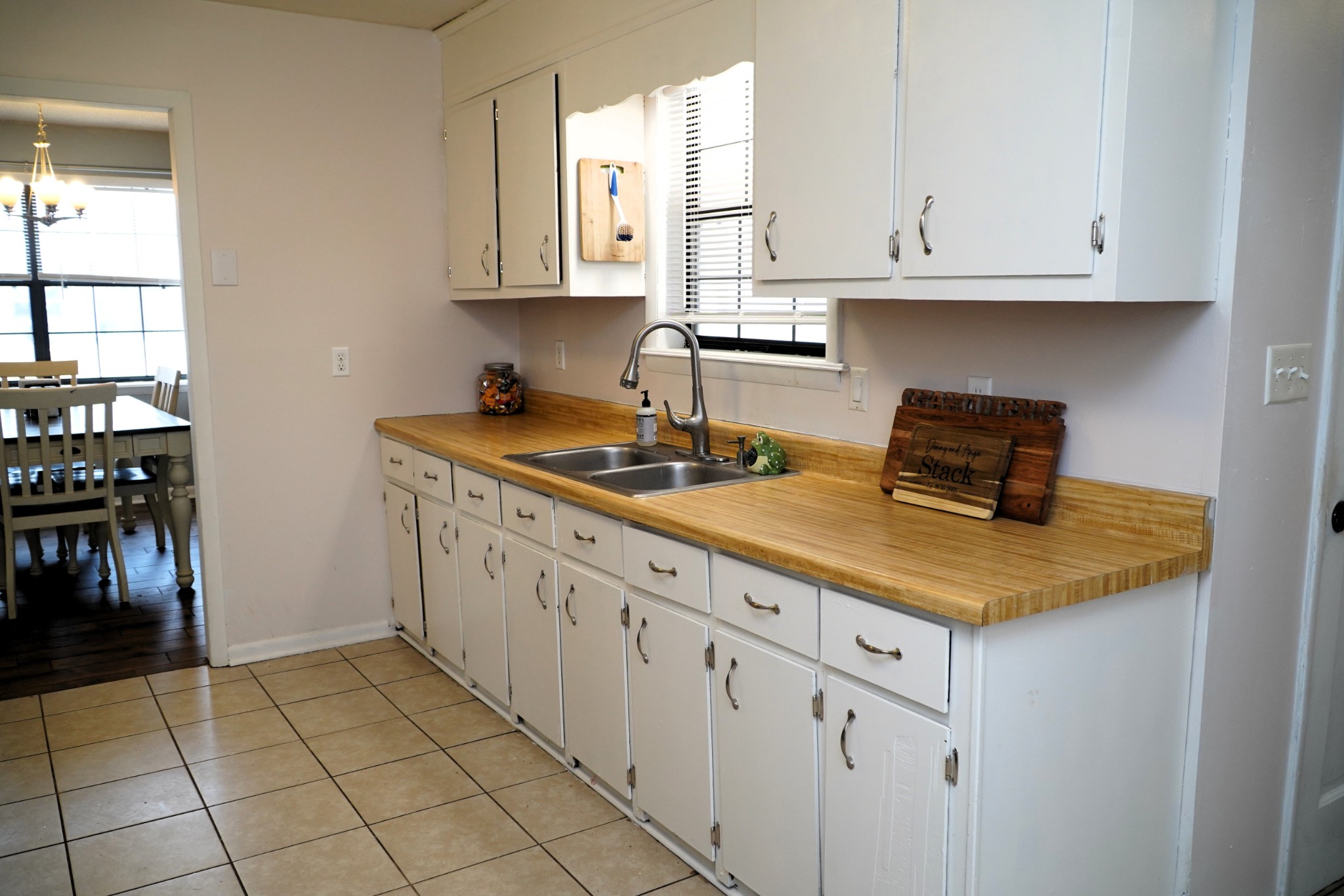 102 McDougal Road Fayetteville, TN 37334 - Photo 9 of 27 a kitchen with stainless steel appliances granite countertop a sink and a white cabinets
