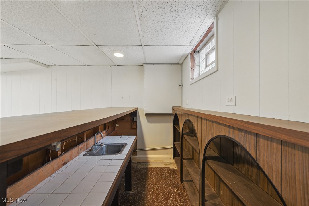 28575 White Road Wickliffe, OH 44092 - Photo 38 of 49 Bar with a paneled ceiling and a sink