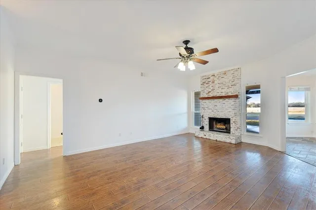 a view of room with a ceiling fan and window