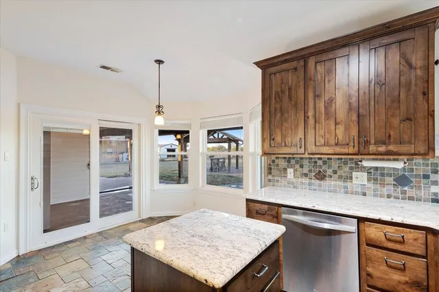 a bathroom with a sink a mirror and a shower
