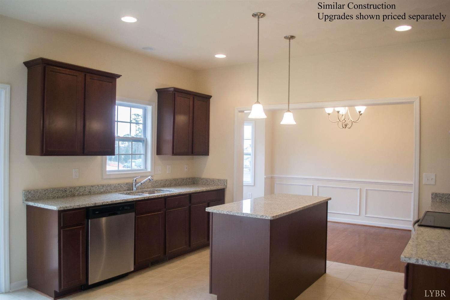 389 Traverse Drive Evington, VA 24550 - Photo 2 of 8 a bathroom with a sink double vanity and a mirror